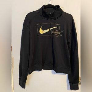 Nike pull over wind breaker. Two tone black, Nike gold letters, zipper v neck